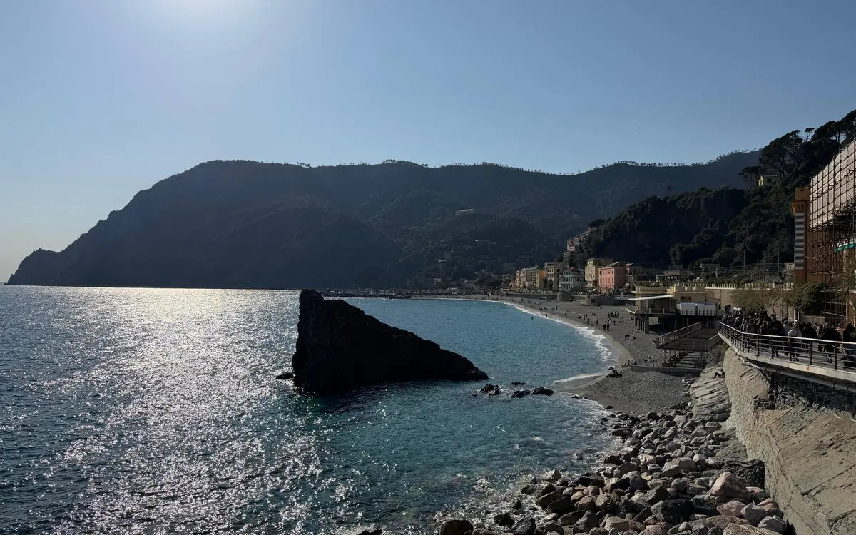 A sea stack off a pebble beach on the Ligurian coast