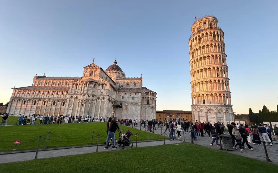 The Leaning Tower and the cathedral with visitors on the lawn