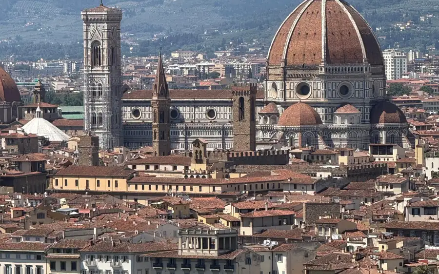 Florence Cathedral's dome and bell tower above the city rooftops