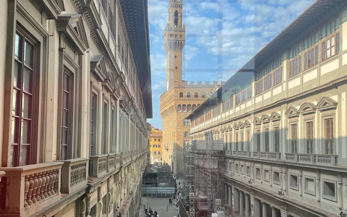 The long Uffizi courtyard seen from an upper window, the Palazzo Vecchio tower at its end